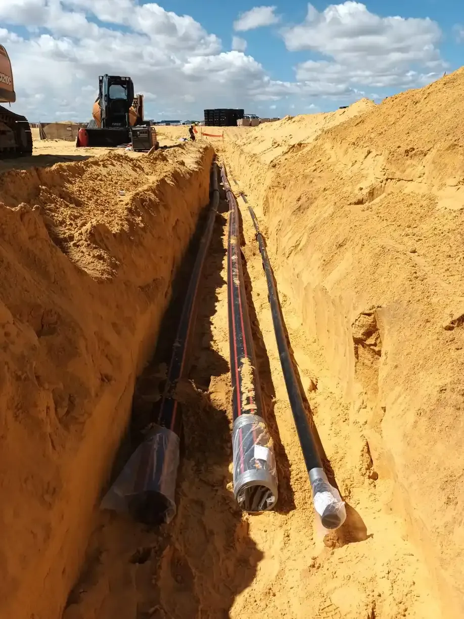 Poly fire-service water mains laid in an open trench.